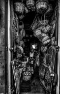 apulia,baskets,shop,man,inside,bw.jpg