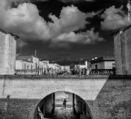 apulia,mesagne,arch,woman,bw.jpg